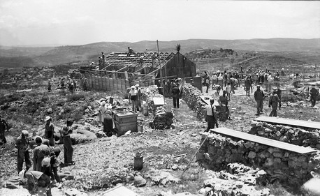 Erecting the first house at Maaleh HaHamisha, 1938. KKL-JNF Photo Archive Erecting the first house at Maaleh HaHamisha, 1938. KKL-JNF Photo Archive