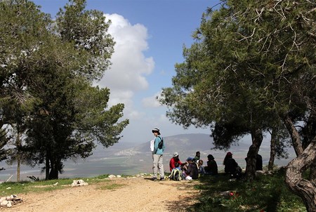 Hikers looking out at Mount Tabor. Photo: Yaakov Skolnik